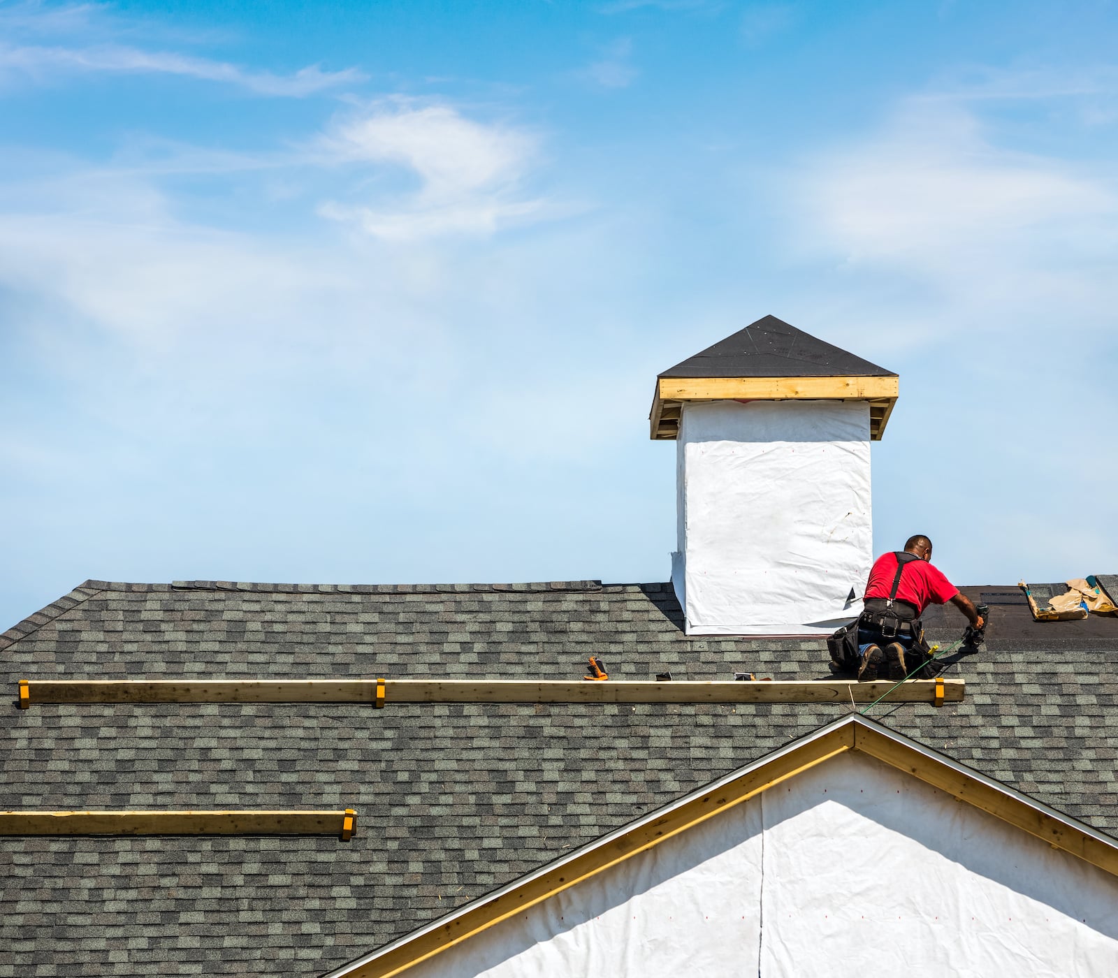 photo of roofing contractor on roof
