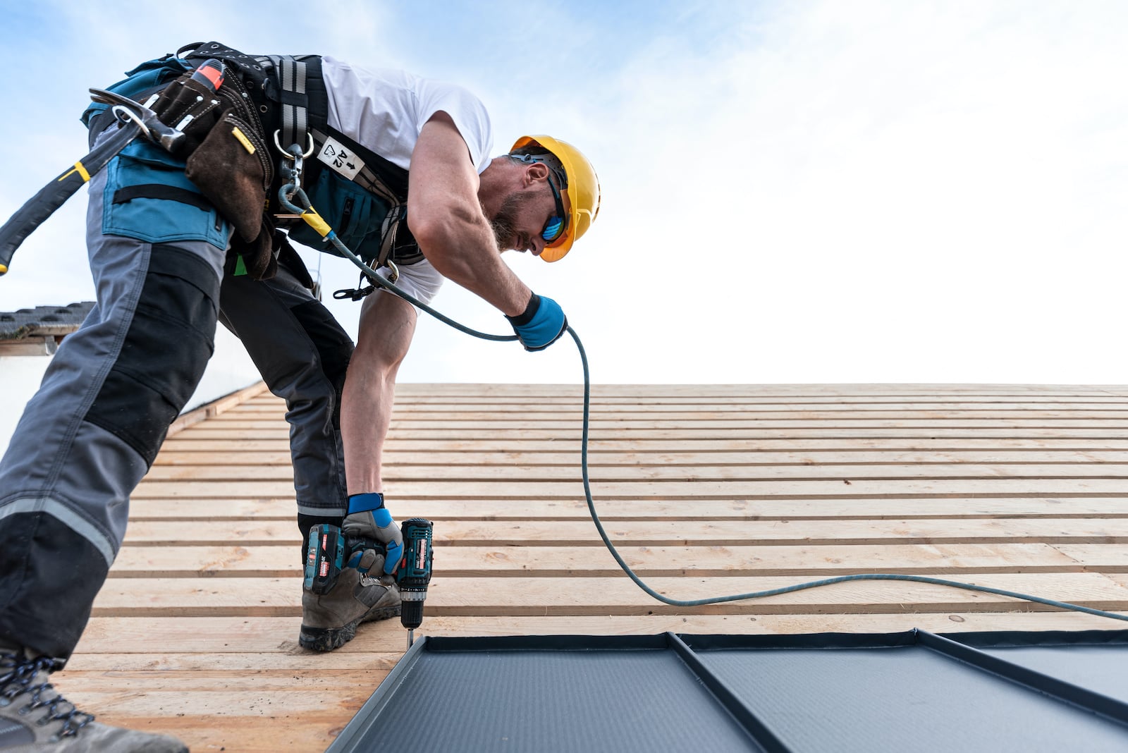 photo of roofer on roof